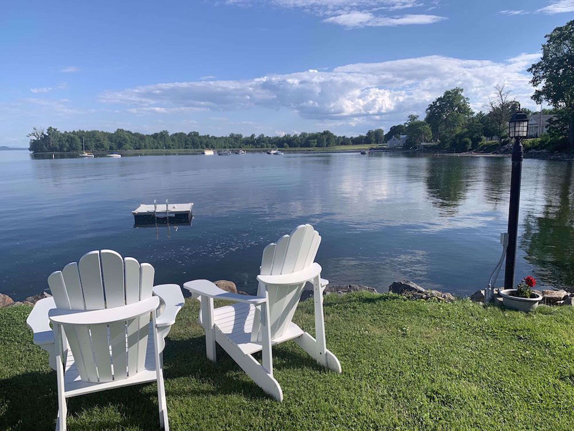 Lake Champlain waterfront with Adirondack chairs
