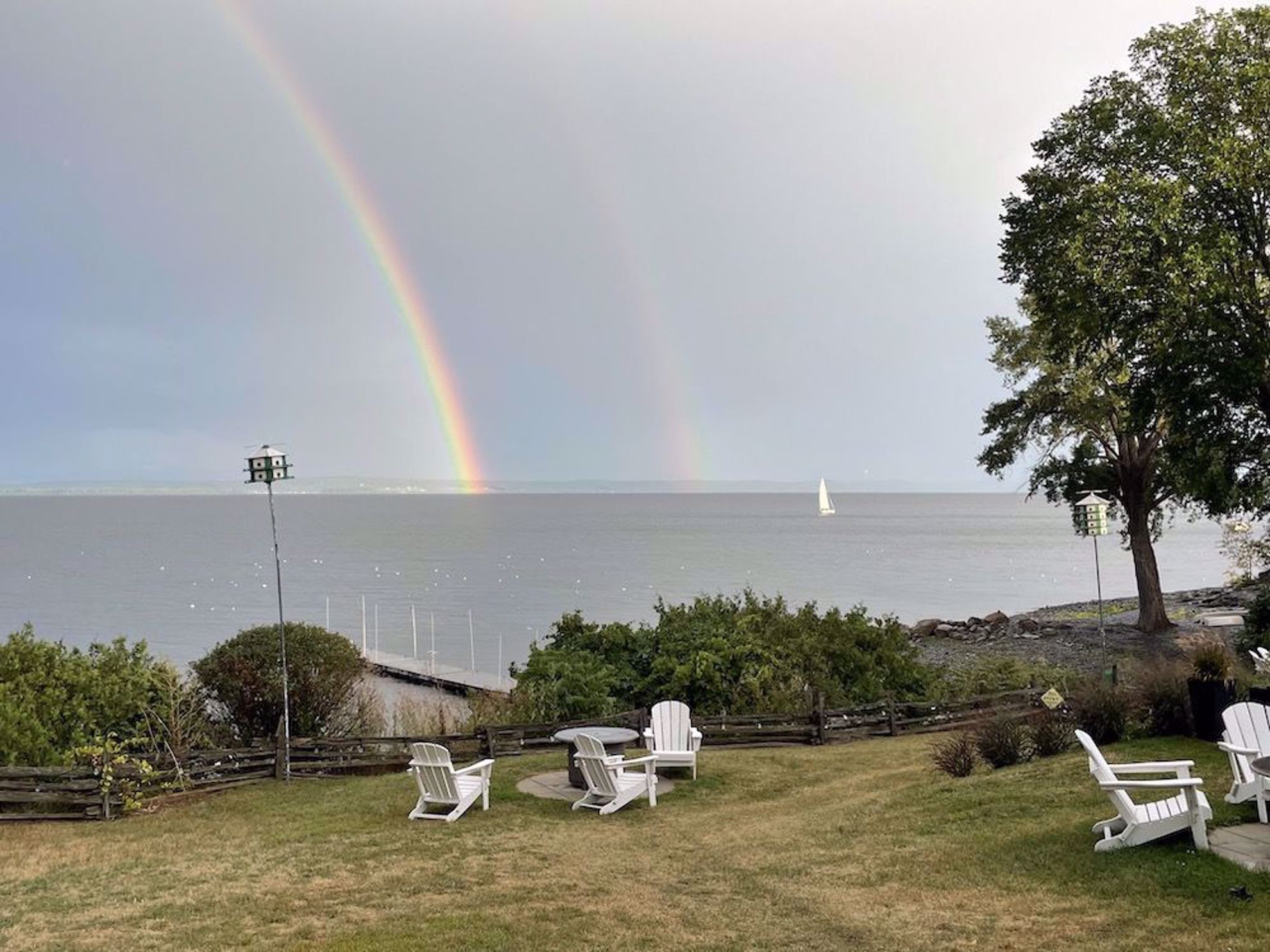 Lake Champlain waterfront with double rainbow