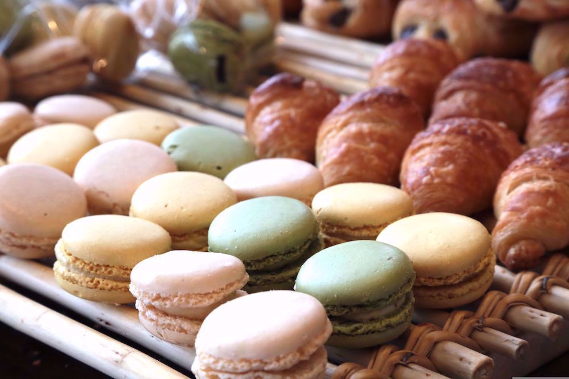 Macarons and croissants in French bakery