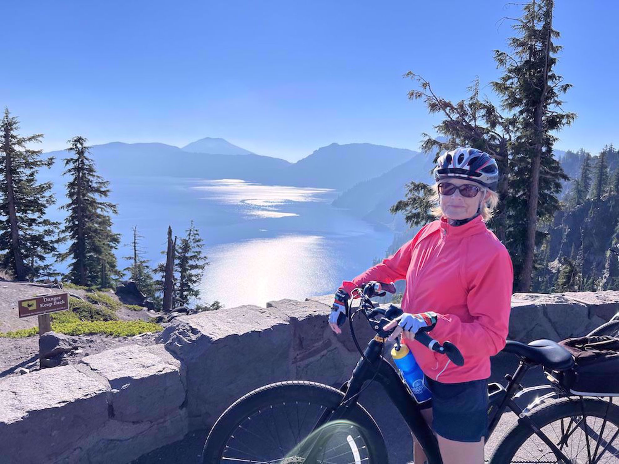 Happy biker above Crater Lake